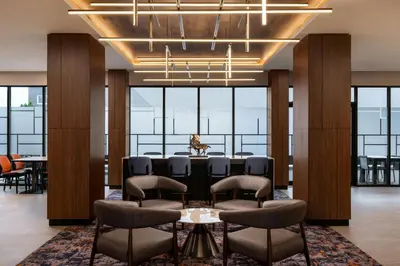 a conference room with a table and chairs and windows at TownePlace Suites by Marriott Chilliwack in Chilliwack