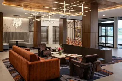 a lobby with couches and a table and chairs at TownePlace Suites by Marriott Chilliwack in Chilliwack