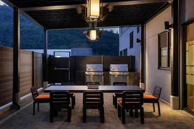 a patio with a table and chairs on a balcony at TownePlace Suites by Marriott Chilliwack in Chilliwack