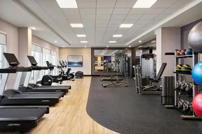 a gym with rows of treadmills and exercise equipment at TownePlace Suites by Marriott Chilliwack in Chilliwack