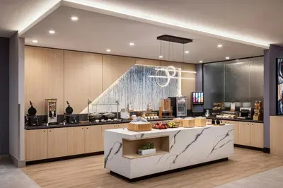 a large kitchen with a counter in the middle at TownePlace Suites by Marriott Chilliwack in Chilliwack