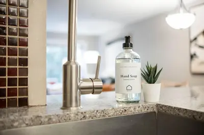 a bottle of hand soap sitting on a counter at Aspens Lodge 220 by Outpost Whistler in Whistler