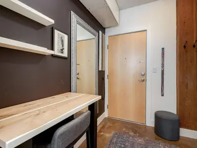 a room with a wooden counter and a door at Old Town Retreat-your artful escape in Victoria’s historic Old Town by Victoria Prime! in Victoria