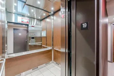 a elevator with the number on the door at Modern 2BR 2BA Condo in Heart of Vancouver in Vancouver