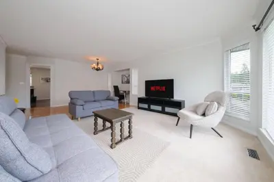 a living room with a couch and chairs and a tv at Surrey Family Home w/ Patio & Garden – 3BR 2BA in Surrey