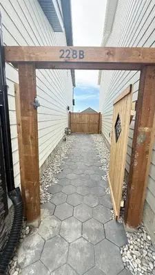 an entrance to a garage with a wooden door at Rustic Rocky Retreat in Calgary