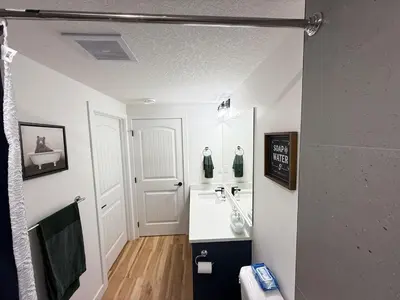 a bathroom with a sink and a toilet at Rustic Rocky Retreat in Calgary