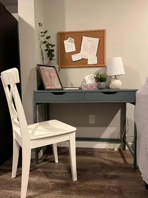 a desk with a laptop and a chair at stylish 5-Star Suite 1BD 1 Bath Le Reve Beaumont in Nisku