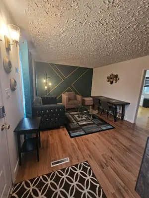 a living room with a couch and a table at Aansel Suites 2 bedroom in Edmonton