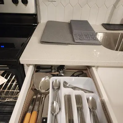 a drawer in a kitchen with utensils in it at Spacious 2 Bedroom Suite in Gorman, Edmonton, Canada in Edmonton