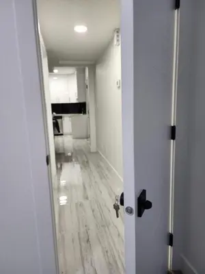 an open door to a room with a hallway at Spacious 2 Bedroom Suite in Edmonton, Canada in Edmonton