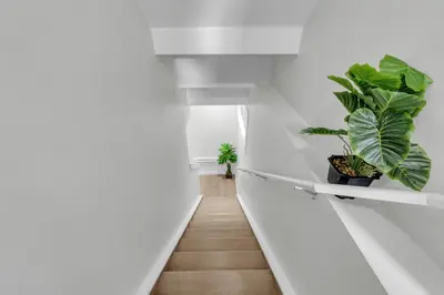 a hallway with plants on the wall at Cozy Luxe Suite in Calgary