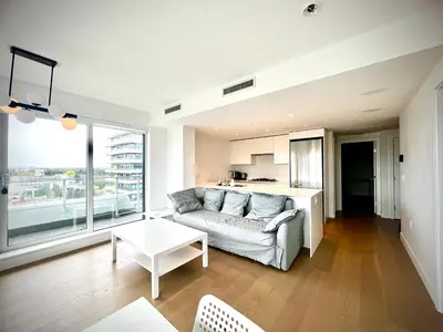 a living room with a couch and a table at Central Stylish 3B2B near Richmond Center in Richmond