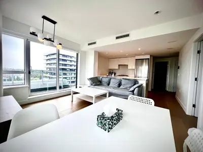 a living room with a white table and a couch at Central Stylish 3B2B near Richmond Center in Richmond