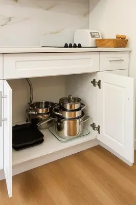 a kitchen with two pots and pans on a shelf at Deep Cove holiday in North Vancouver