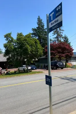 a street sign on the side of a road at Deep Cove holiday in North Vancouver