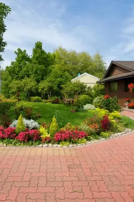 a garden with colorful flowers in a brick driveway at Deep Cove holiday in North Vancouver