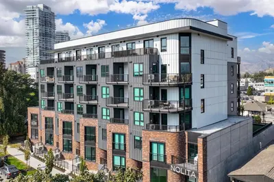 an apartment building with balconies on top of it at Brand new suite downtown Kelowna - walk everywhere! in Kelowna