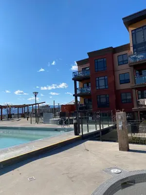 an outdoor swimming pool in a apartment complex at PlayadelSol in Kelowna