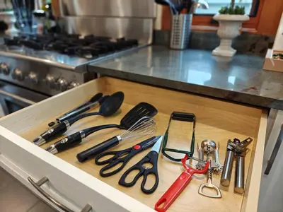 a drawer with a bunch of kitchen utensils on it at Quiet Modern Dundadrave Oasis in West Vancouver