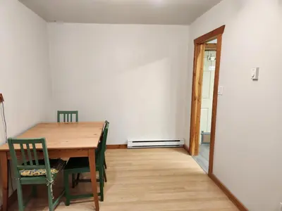 a dining room with a wooden table and chairs at Alpenrose 204 Hottubs, Mountains View, KING bed in Golden