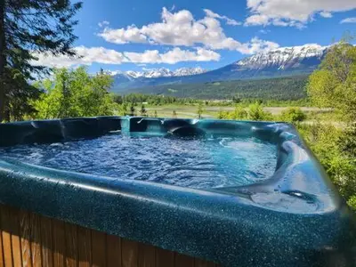 a hot tub with a view of a mountain at Alpenrose 204 Hottubs, Mountains View, KING bed in Golden