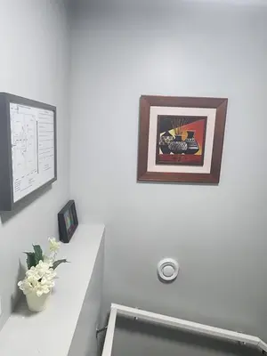 a bathroom with a sink and a picture on the wall at Home in Northwest Calgary in Calgary