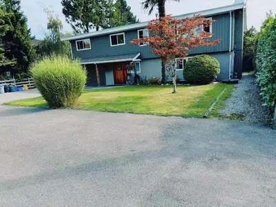 a house with a driveway in front of it at sweet home in Delta