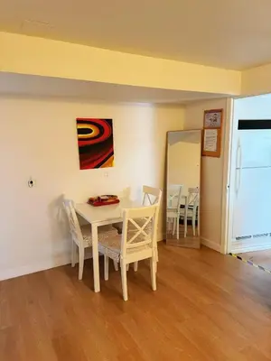 a dining room with a table and chairs at sweet home in Delta