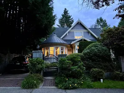 a house with a gate in front of it at Kerrisdale cozy house in Vancouver