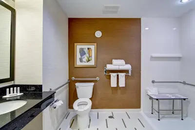 a bathroom with a toilet and a sink at Fairfield Inn & Suites by Marriott Kamloops in Kamloops