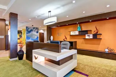 a lobby of a hotel with a reception desk at Fairfield Inn & Suites by Marriott Kamloops in Kamloops