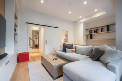 a living room with a couch and a table at Fitzsimmons Walk 16 by Outpost Whistler in Whistler