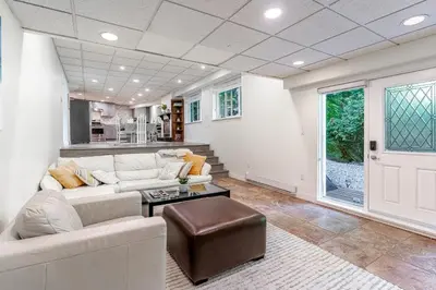 a living room with a couch and a table at Spacious 3Bedrooms Family Getaway in North Vancouver in North Vancouver