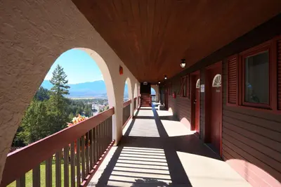 a balcony of a building with a view of the mountains at Radium Chalet in Radium Hot Springs