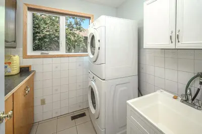 a white washer and dryer in a kitchen at Centrally located 1 Bed 1 Bath Ensuite Cute Guest Suite Private Laundry Pet OK in Calgary