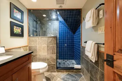 a bathroom with a shower and a toilet at Foxglove 16 by Outpost Whistler in Whistler