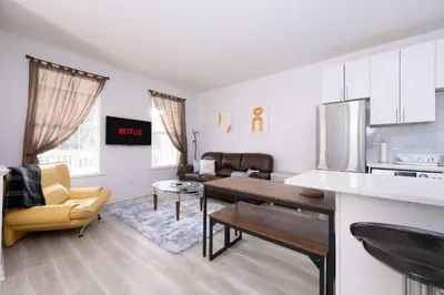 a kitchen and living room with a table and chairs at 3BR 2BA Surrey Home | Quiet & Convenient in Surrey