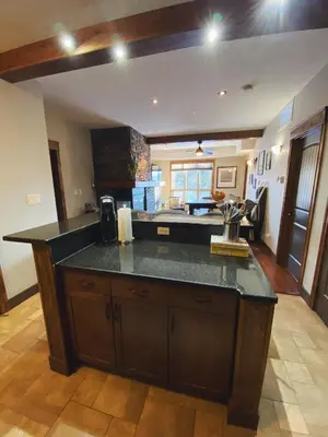 a kitchen with a large island in the middle at Sable Ridge Retreat in Radium Hot Springs