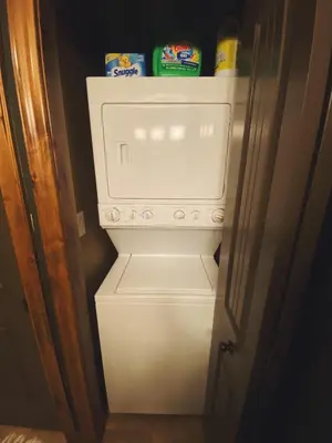 a white refrigerator with some food inside of it at Sable Ridge Retreat in Radium Hot Springs