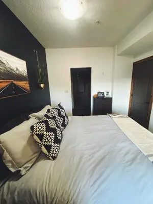 a bedroom with a bed with two pillows on it at Sable Ridge Retreat in Radium Hot Springs