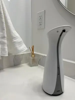 a white and black vase sitting on a counter at 1Bd Modern Suite close to Langley Events Centre and Hwy1 in Langley