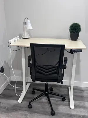 an office desk with a black chair sitting at it at Elegant Cozy Private Apartment in Calgary