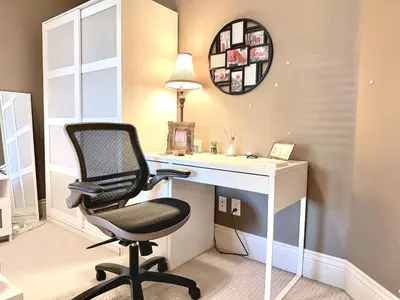 a room with a desk and a chair and a mirror at Scorpio House Langley in Langley