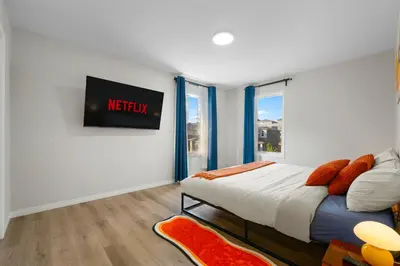 a bedroom with a king sized bed and a window at The Ultimate Getaway with Central AC, 3 King Beds, Hot Tub, Pool Table and More in Balzac