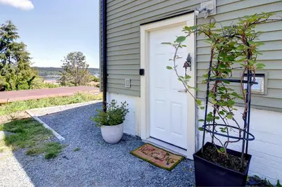 a door to a house with a plant next to it at Viewtiful Stay in Ladysmith
