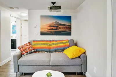 a living room with a couch and a picture on the wall at Viewtiful Stay in Ladysmith