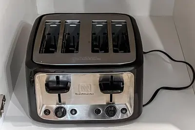 a black toaster sitting on top of a table at ~CozySpacious3bedroomRetreat~FREEparking•2.5bath in Edmonton