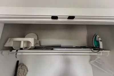 a shelf with a printer and other items on it at ~CozySpacious3bedroomRetreat~FREEparking•2.5bath in Edmonton
