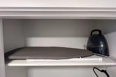 a shelf with a pillow and a kettle on it at •SteamyRomanticBsmntSuite•KingBed•Wifi•Netflix in Edmonton